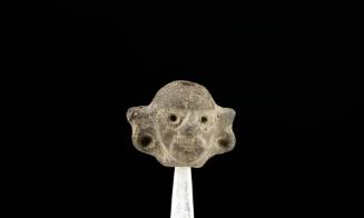 Miniatura con representación de cabeza humana