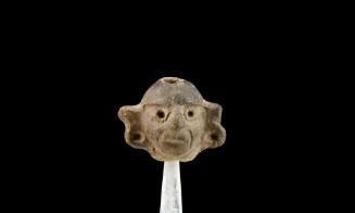 Miniatura con representación de cabeza humana