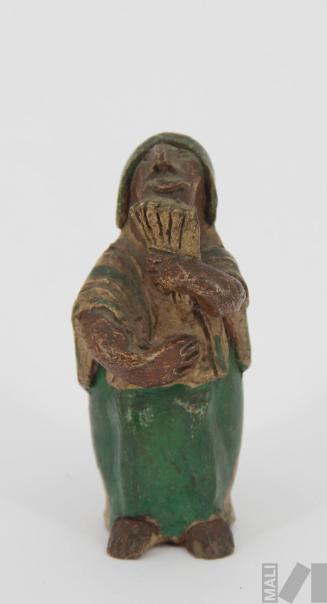 Silbato en forma de músico